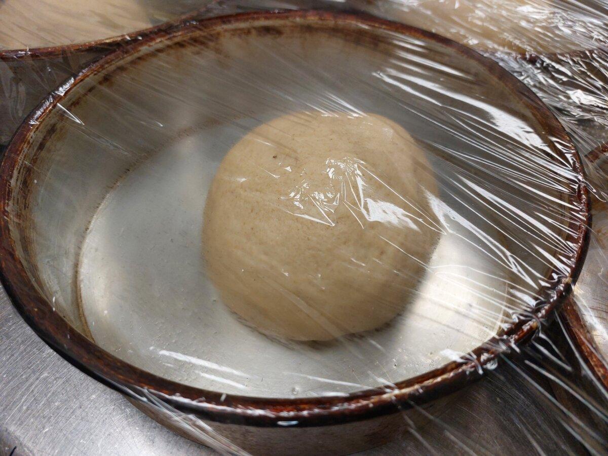 Shape the dough into a ball, then place it in a bowl and cover it to let it rise. (Kevin Revolinski)
