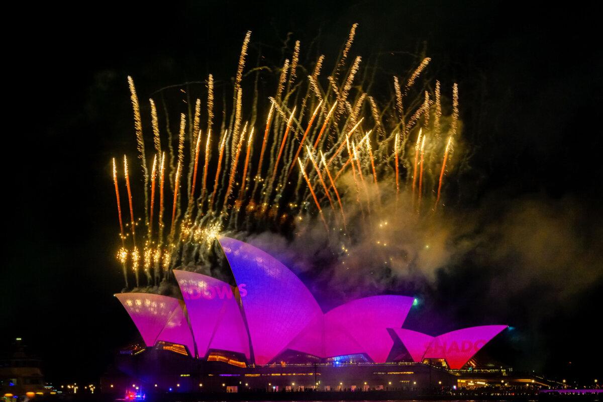 Why Cities and Towns Pick Fireworks, Drones, or Both for Independence Day | USNN World News Fireworks are launched off the top of the sails of the Sydney Opera House to start Vivid Sydney 2025 in Australia on May 23, 2025. (Izhar Khan/Getty Images)