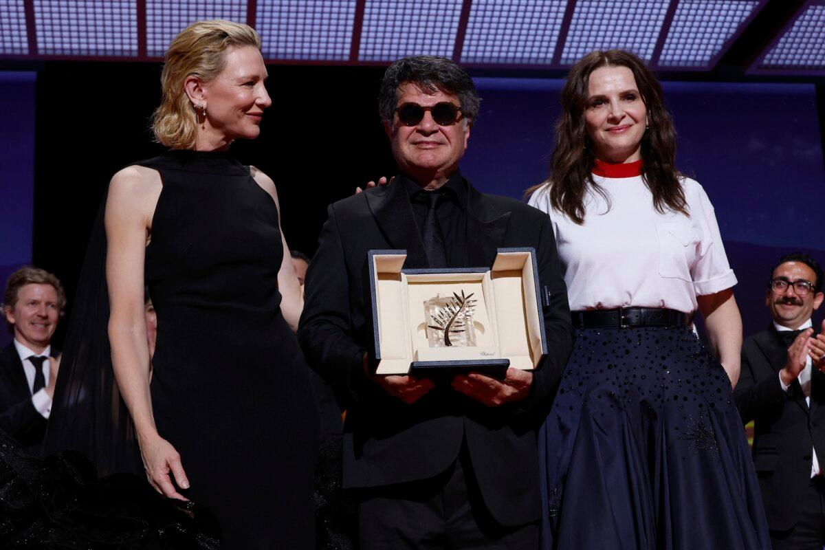 Director Jafar Panahi, center, accepts the Palme d'Or for the film ‘It Was Just an Accident,’ as he poses with Cate Blanchett, left, and jury president Juliette Binoche during the awards ceremony of the 78th Cannes Film Festival in Cannes, France, on May 24, 2025. (Photo by Joel C Ryan/Invision/AP)