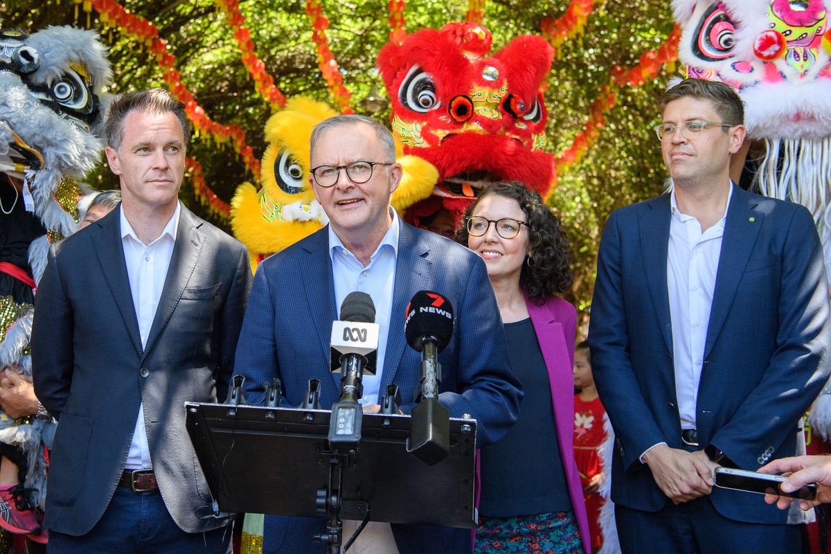 Labour Prime Minister Anthony Albanese will speak to the media at the front door during the month's New Year celebration at Eastwood Plaza on February 4, 2023 in Sydney, Australia along with MP Jerome Laxarle (R) and NSW Premier Chris Mins (L) in Sydney, Australia.