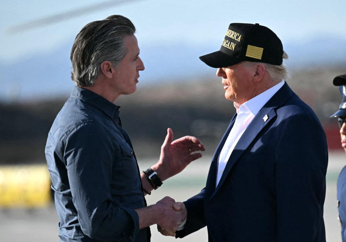 President Donald Trump (R) shakes hands with California Gov. Gavin Newsom (L) upon arrival at Los Angeles International Airport on Jan. 24, 2025. (Mandel Ngan/AFP via Getty Images)