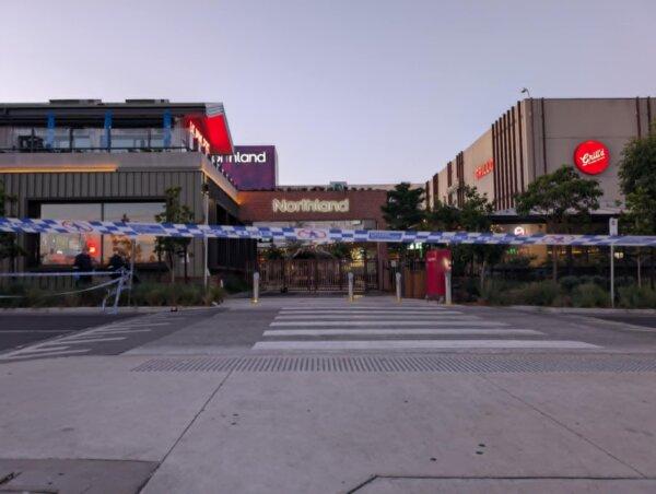 A photo of police tape in front of the Northland Shopping Centre in Preston, Melbourne in Australia. (Josh Spasaro/The Epoch Times)