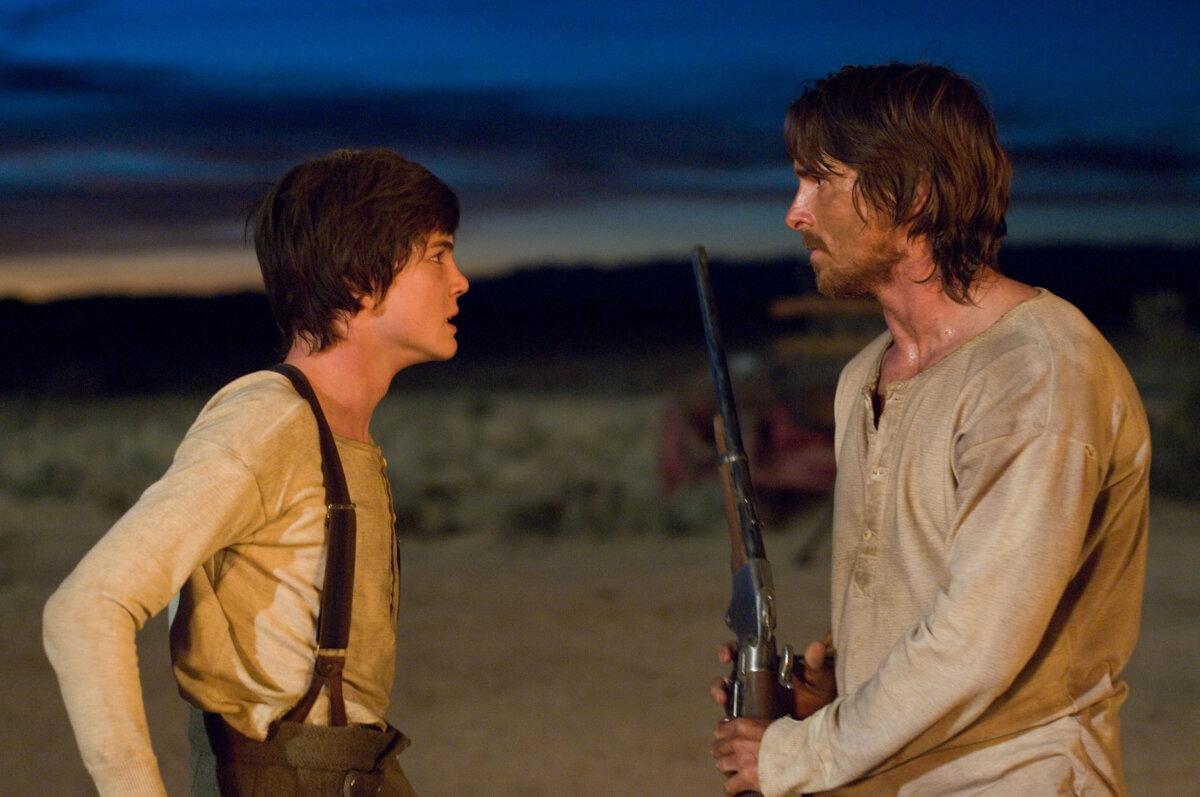 William Evans (Logan Lerman, L) clashes with his father, Dan Evans (Christian Bale), in "3:10 to Yuma." (Lionsgate Entertainment/MovieStillsDB)