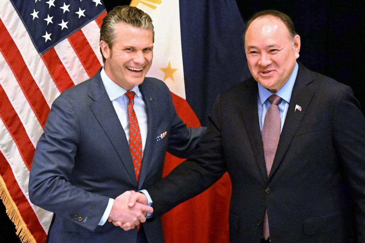 U.S. Secretary of War Pete Hegseth (L) shakes hands with Philippines Secretary of National Defense Gilberto Teodoro (R) before a bilateral meeting on the sidelines of the Shangri-La Dialogue Summit in Singapore on May 30, 2025. (Mohd Rasfan /AFP via Getty Images)