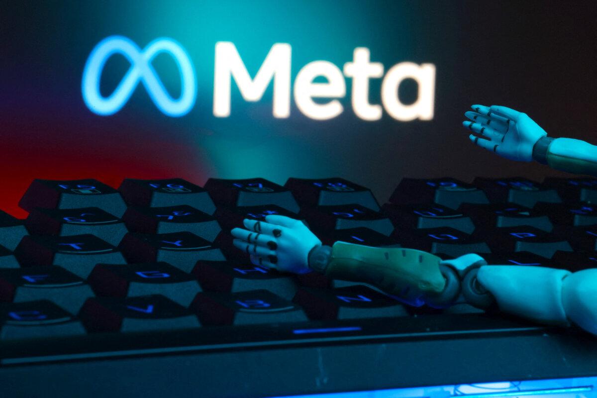 The Meta logo, a keyboard, and robot hands are seen in this illustration taken on Jan. 27, 2025. (Dado Ruvic/Illustration/Reuters)