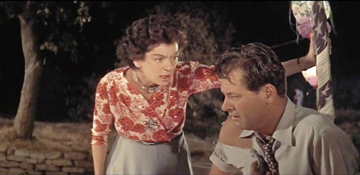 Rosemary Sydney (Rosalind Russell) lays into Hal Carter (William Holden), in “Picnic.” (Columbia Pictures)