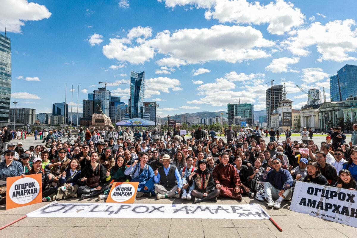 People celebrate the resignation of Mongolian Prime Minister Luvsannamsrai Oyun-Erdene, at the Sukhbaatar Square in Ulaanbaatar on June 3, 2025. (Byambasuren Byamba -Ochir/AFP via Getty Images)