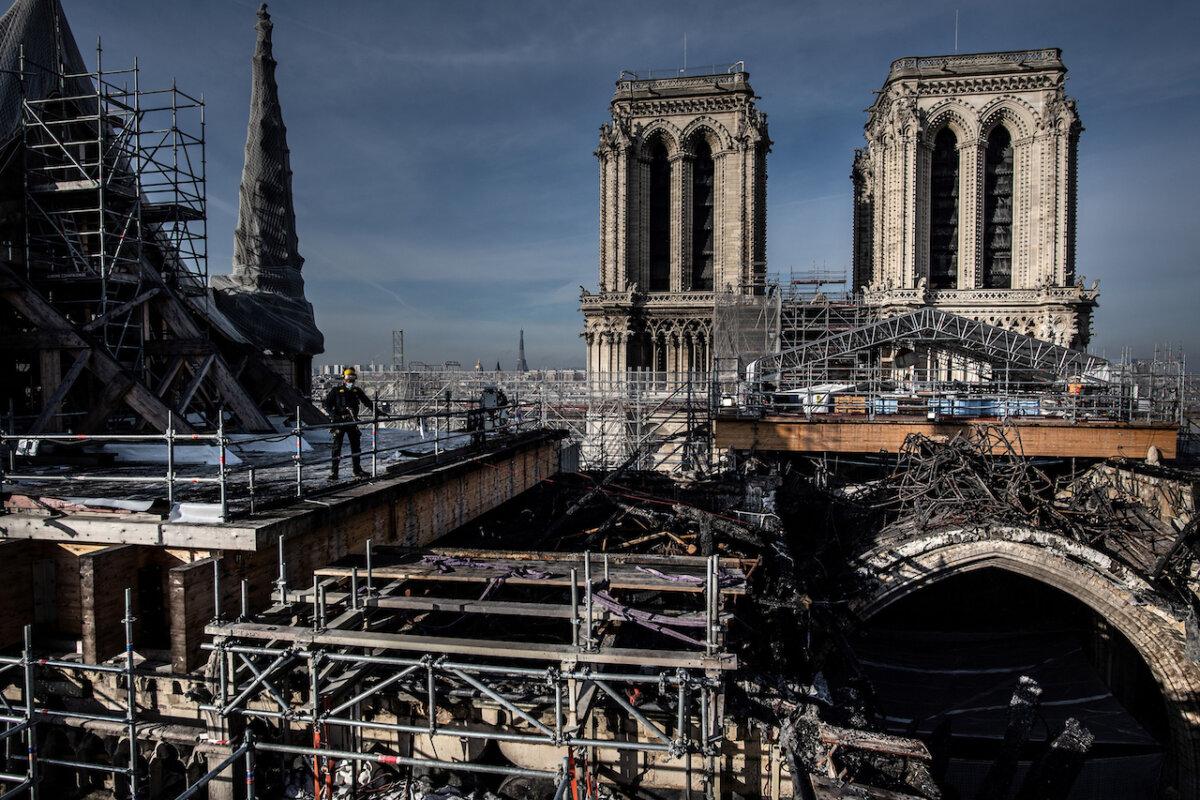 Workers on the roof of Notre-Dame work to remove the burnt scaffolding which hampered the safety of the cathedral damaged by the April 15, 2019 fire on November 24, 2020 in Paris. (MARTIN BUREAU/AFP/Getty Images)