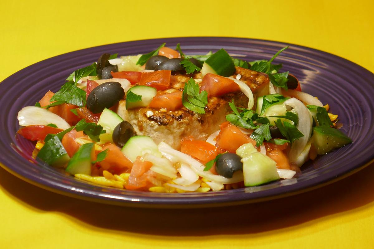 Italian-Style Swordfish With Tomato, Olive, and Cucumber Salad and Turmeric Spiced Orzo