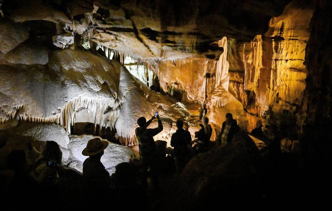 Visitors walk through the Dome Room in Crystal Cave within California's Sequoia National Park before it reopens officially to the public following years of closures due to COVID-19, fires, and floods. (Craig Kohlruss/The Fresno Bee/TNS)