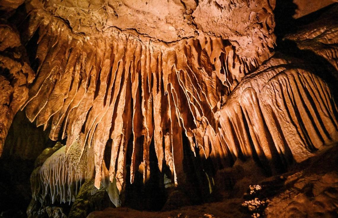 Calcium carbonate formations appear above the fairy pools in Crystal Cave, where visitors can once again see inside following years of its being closed. (Craig Kohlruss/Fresno Bee/TNS)