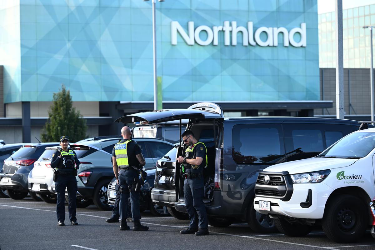 A Victoria Police car and signage at the following a machete brawl between youth gangs at the Northland Shopping Centre in Melbourne, Australia on May 26, 2025. (AAP Image/Joel Carrett)