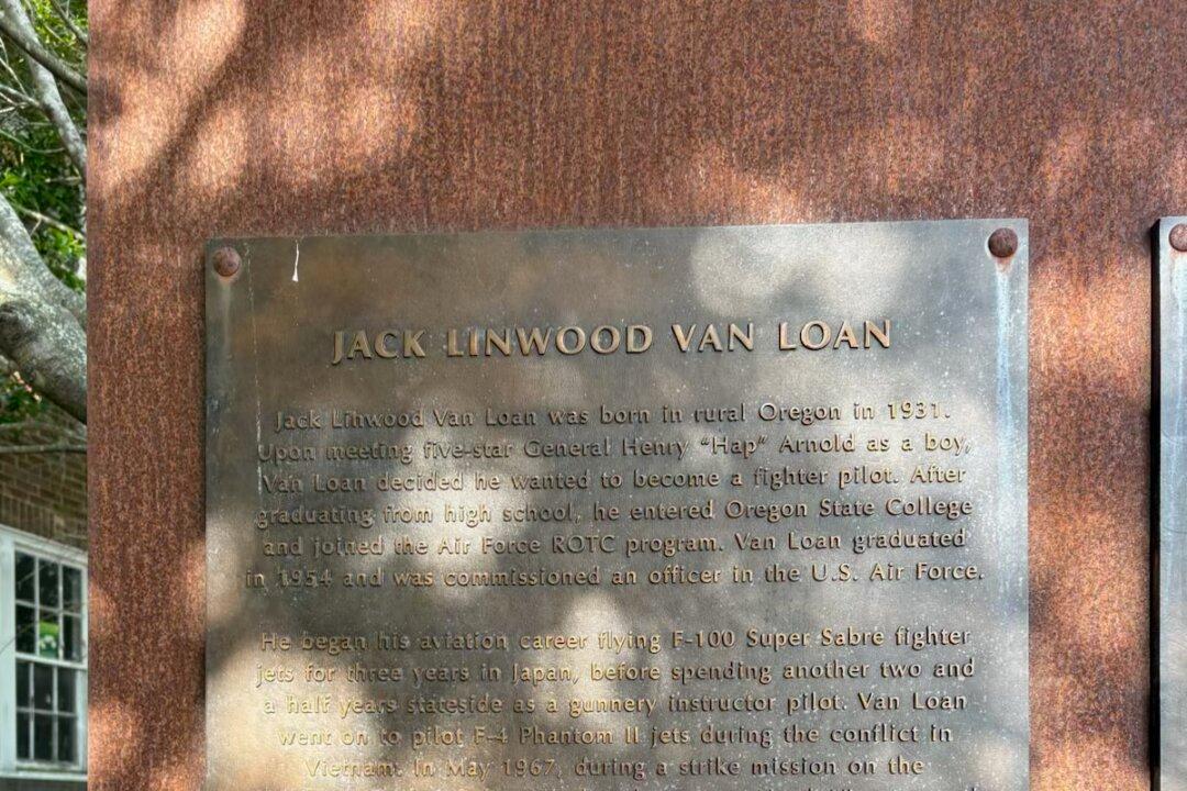 The memorial plaque explains some of veteran Jack Van Loan's story. (Deena Bouknight)