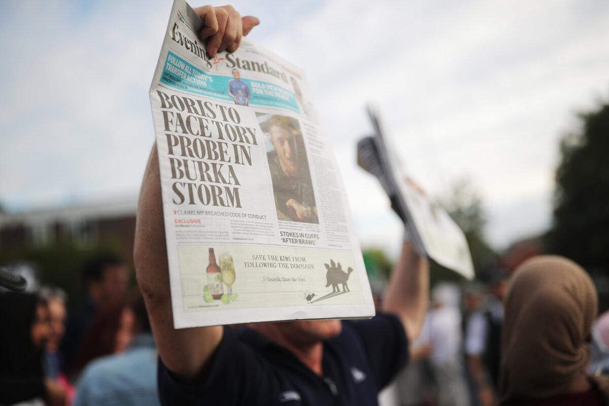 Locals protested after comments by former Foreign Secretary Boris Johnson against Muslim women wearing burkas on August 9, 2018 outside the UK's Hillingdon Conservative Association's Association office.