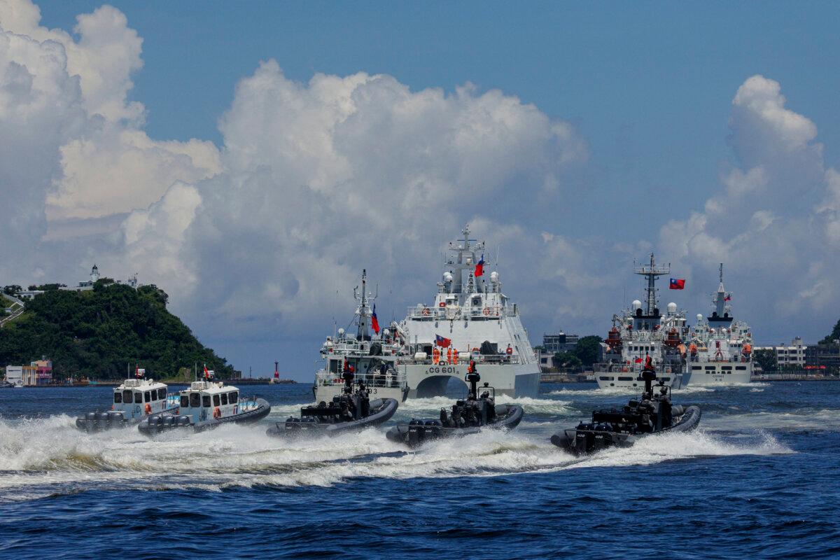Coast Guard Special Task Unit (STU) officers, an elite unit within the Taiwanese Coast Guard Administration, responsible for high-risk operations like counter-terrorism, anti-smuggling, and air-sea rescue, prepare to board a “hijacked” vessel taking part in the “Sea Safety No.12” exercises during a maritime drill in Kaohsiung, Taiwan, on June 8, 2025. (Yu Chen Cheng/AFP via Getty Images)