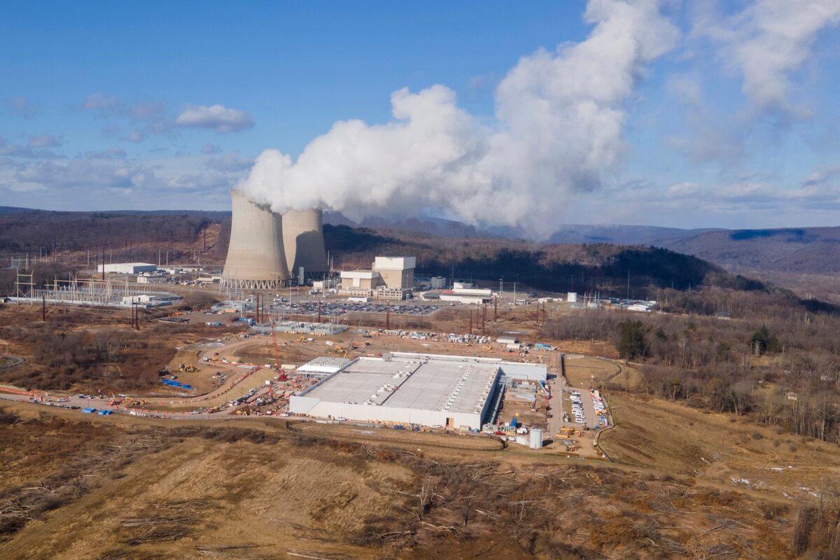 A data center owned by Amazon Web Services (front R) is under construction next to the Susquehanna nuclear power plant in Berwick, Pa., on Jan. 14, 2024. (AP Photo/Ted Shaffrey)
