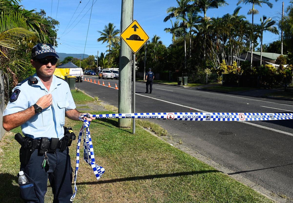 Police attend the scene of a mutliple stabbing in Cairns, Australia, on Dec. 19, 2014. (Ian Hitchcock/Getty Images)