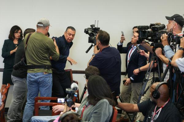 Sen. Alex Padilla (D-Calif.) is removed from the room after interrupting a news conference with Department of Homeland Security Secretary Kristi Noem at the Wilshire Federal Building in Los Angeles on June 12, 2025. (Patrick T. Fallon/AFP via Getty Images)