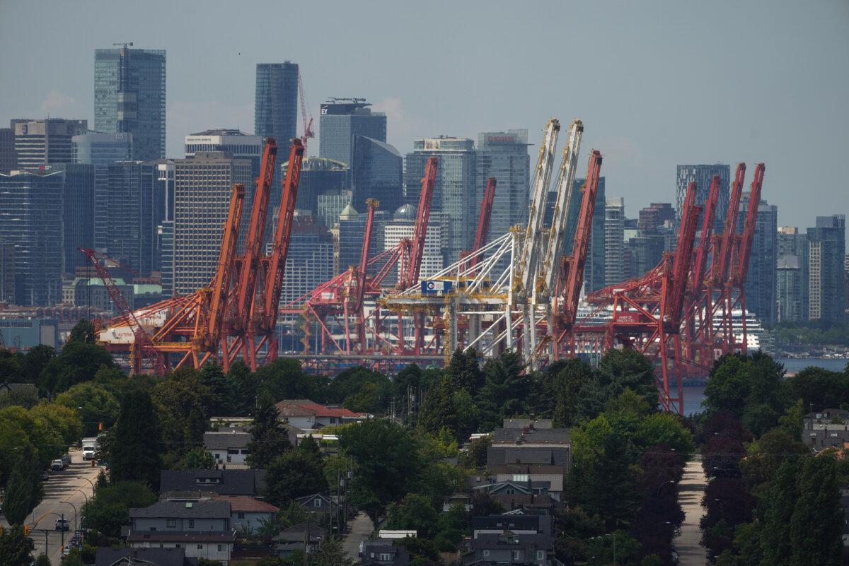 Gantry cranes used to load and unload cargo containers from ships are seen in Vancouver, on July 12, 2023. (The Canadian Press/Darryl Dyck)