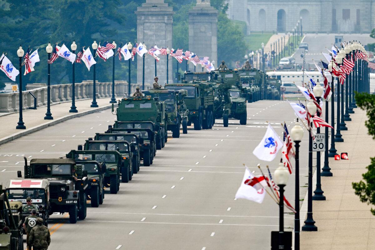Armored vehicles drive across the Memorial Bridge during the Army 250th Anniversary Parade in Washington on June 14, 2025. (Annabelle Gordon /AFP via Getty Images)
