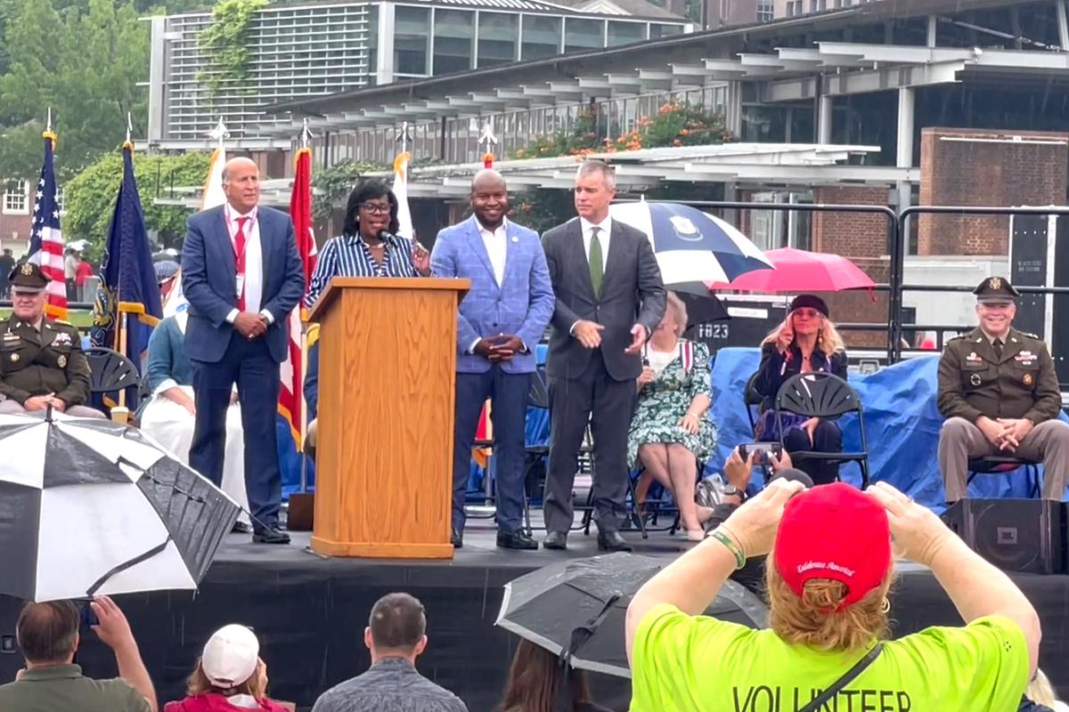 Philadelphia Mayor Cherelle L. Parker (2nd left) delivers a stirring speech during the Stars and Stripes opening ceremony at Independence Mall on June 14, 2025. (Frank Liang/The Epoch Times)