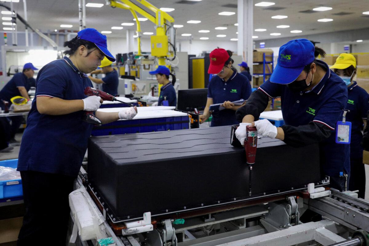 Employees work at a factory that produces lithium battery for export in Huaibei, China, on June 11, 2024. (STR/AFP via Getty Images)