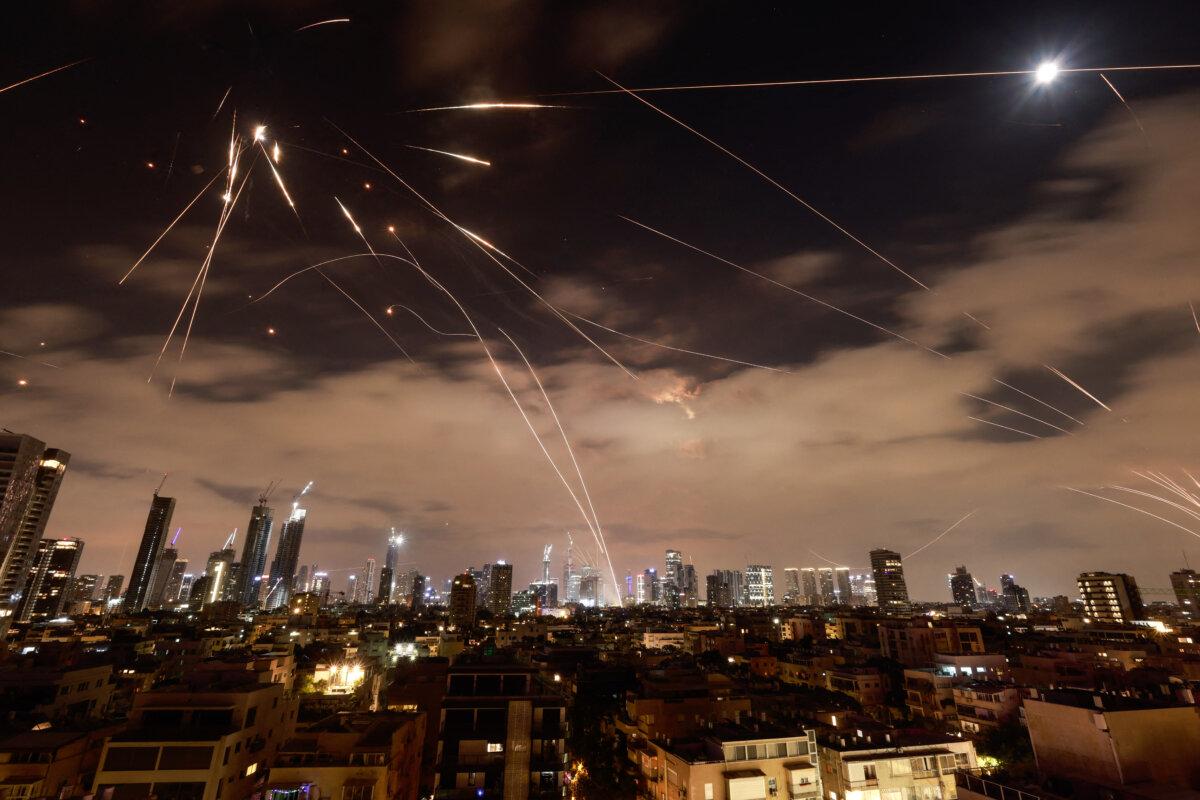 Israeli air defense systems are activated to intercept Iranian missiles over Tel Aviv, Israel, on June 16, 2025. (Menahem Kahana/AFP via Getty Images)