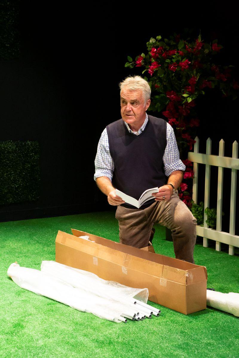 Monty (Tim Marriott) tries to figure out the instruction manual to set up a gazebo for his daughter's wedding, in "A Special Relationship." (Hunter Canning)