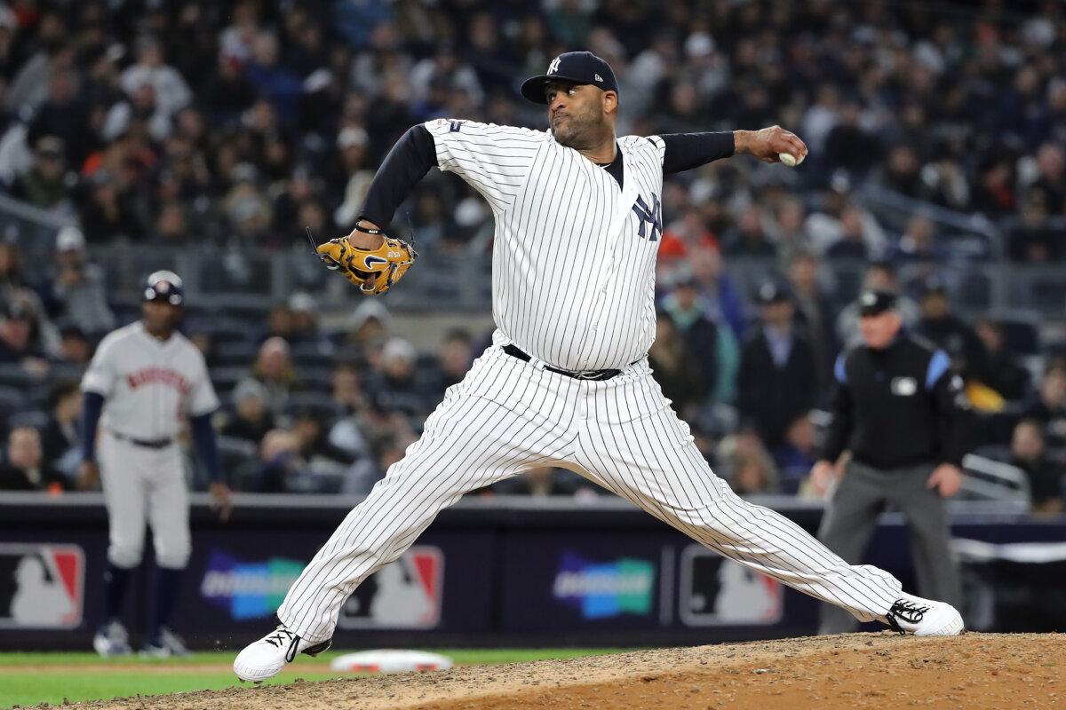 CC Sabathia #52 of the New York Yankees pitches against the Houston Astros in the eighth inning of game four of the American League Championship Series at Yankee Stadium in New York City on Oct. 17, 2019. (Elsa/Getty Images)
