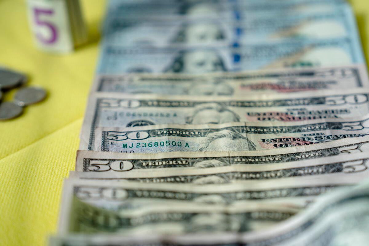 U.S. bank notes and coins. (Madalina Vasiliu/The Epoch Times)