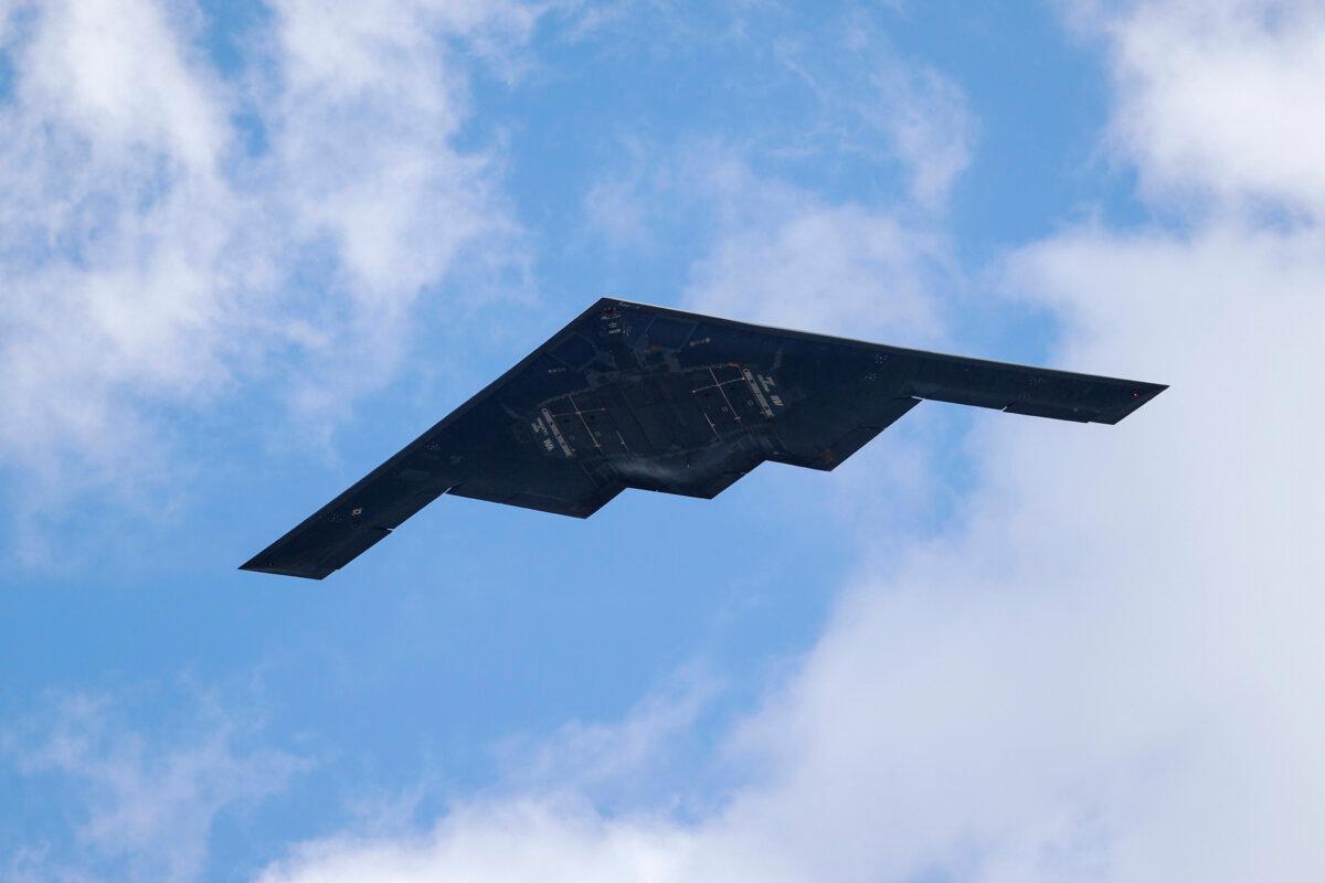 A B-2 Spirit stealth bomber, assigned to the 509th/131st Bomb Wings out of Whiteman Air Force Base, performs a flyover of Barnes-Jewish Hospital in St. Louis on May 8, 2020. (Jeff Roberson/AP Photo)