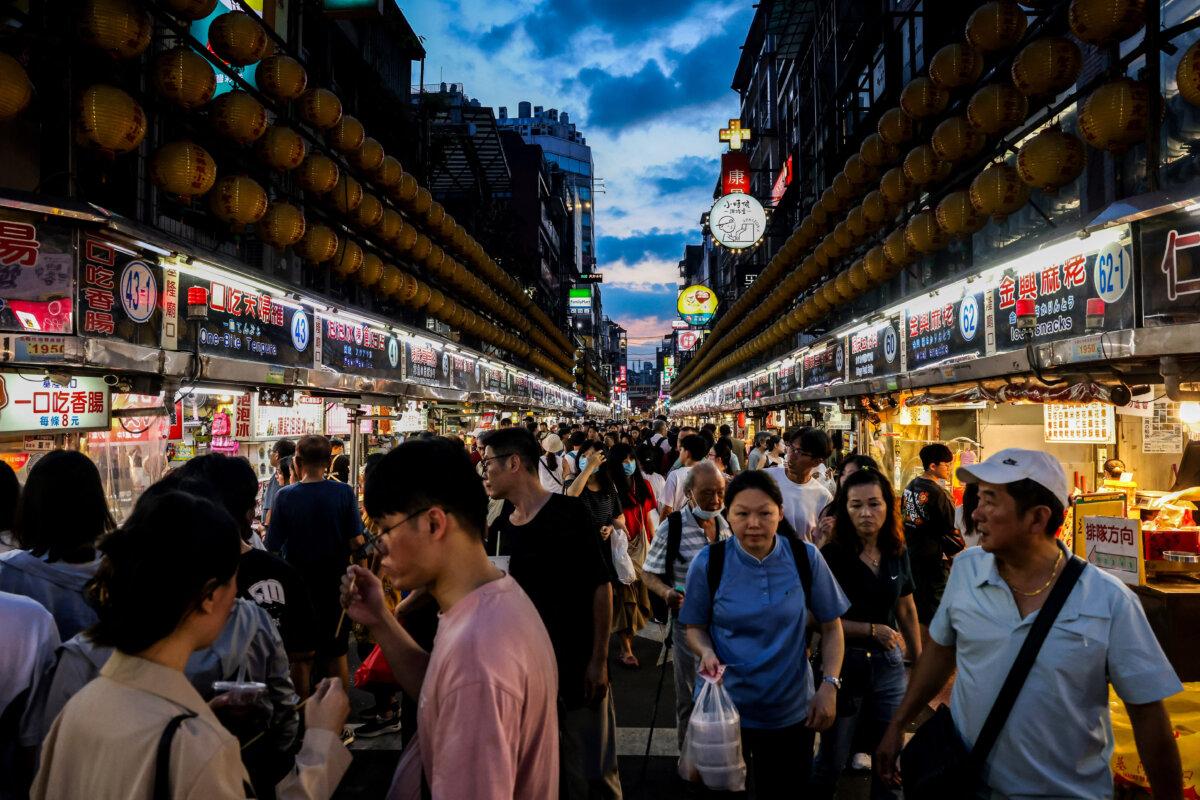 Visitors walk around a local night market in Keelung, Taiwan, on June 26, 2025. (I-Hwa Cheng/AFP via Getty Images)