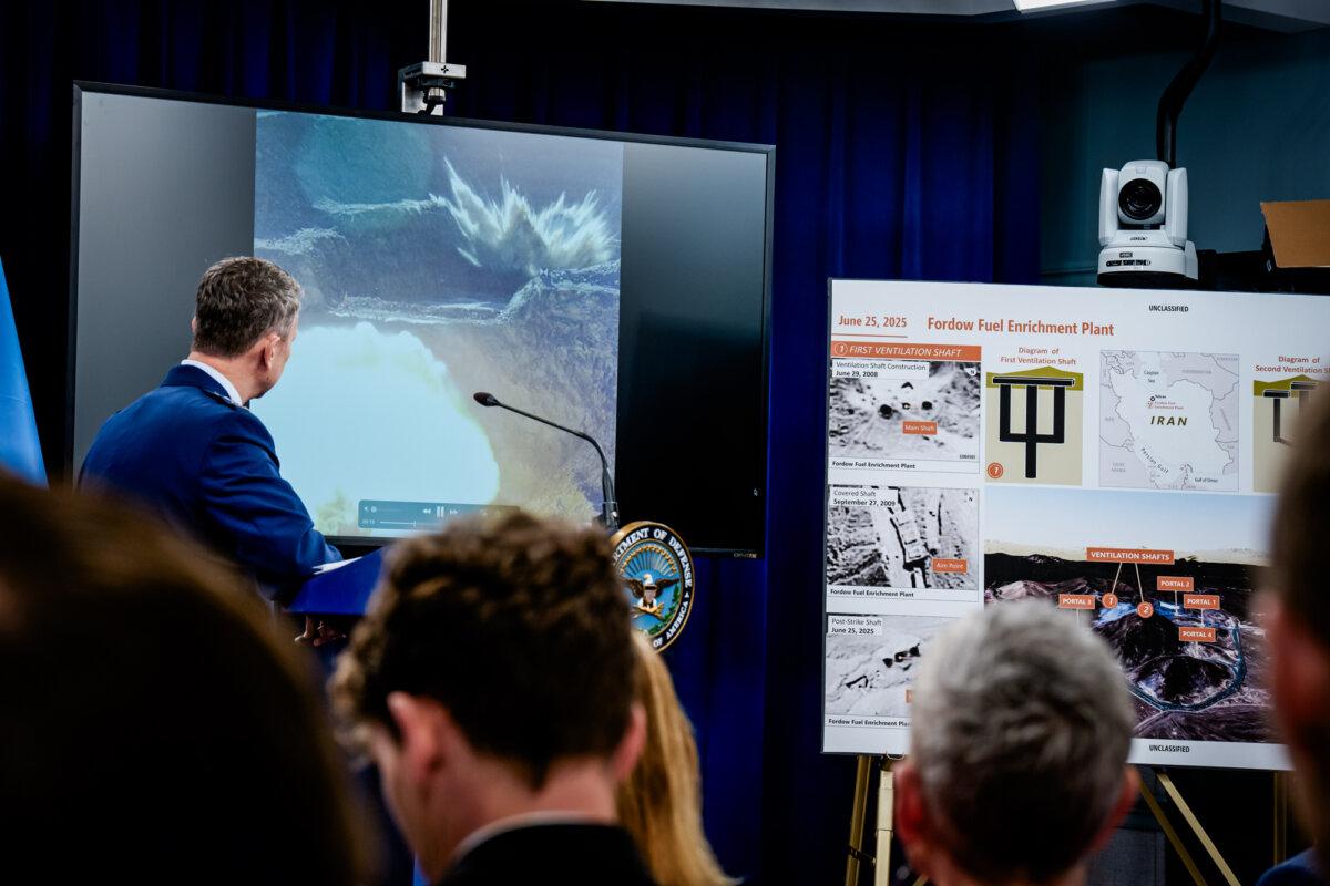 Chairman of the Joint Chiefs of Staff Air Force Gen. Dan Caine watches a video of a bombing test of the GBU-57A/B Massive Ordnance Penetrator (MOP) used in the attack on the Iranian Fordow Fuel Enrichment Plant, during a news conference at the Pentagon in Arlington, Va., on June 26, 2025. (Andrew Harnik/Getty Images)