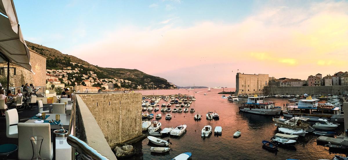 The harbor offers views of the city's ancient, fortified walls. (Lyle Hastie/Unsplash)