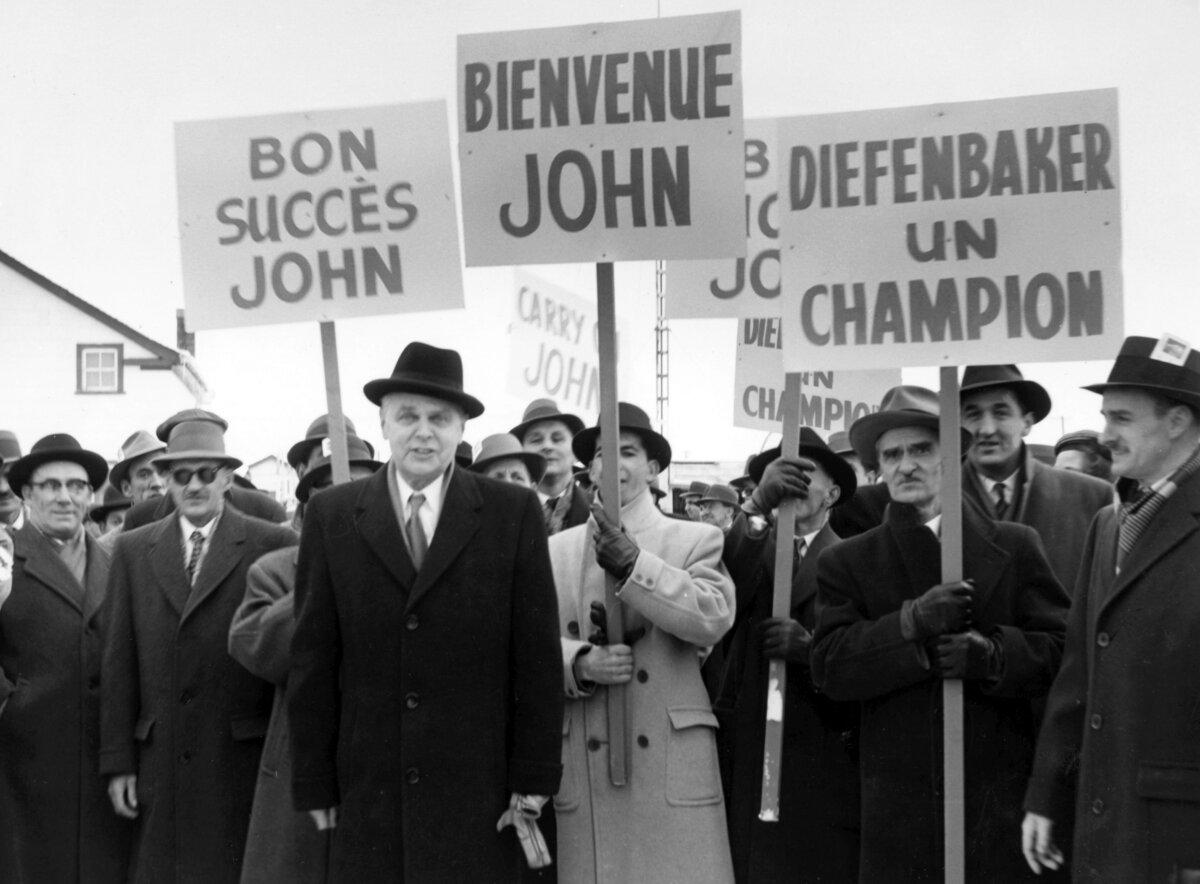 <span style="font-weight: 400;">Prime Minister John Diefenbaker is greeted by supporters in Bagotville, Que., in 1958. </span><span style="font-weight: 400;">Diefenbaker vehemently opposed the design of the “Pearson pennant.”</span><br/><span style="font-weight: 400;">(The Canadian Press)</span>