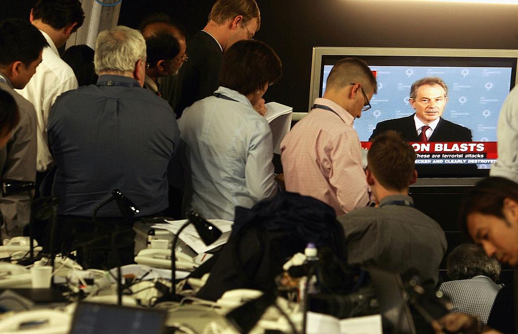 Journalists watch Tony Blair's statement on TV on July 7, 2005, in Gleneagles, Scotland. Blasts had been reported on the London underground network and buses. (Pascal Le Segretain/Getty Images)