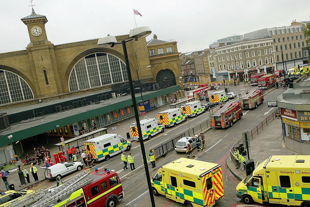Emergency services are seen outside the main line station at Kings Cross following an explosion in London's tube, on July 7, 2005. (Dean Mouhtaropoulos/Getty Images)