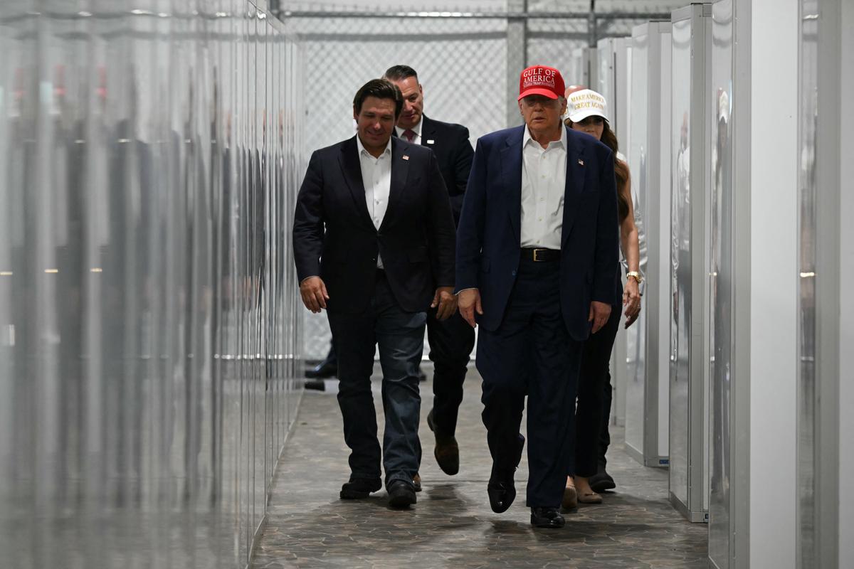 Florida Gov. Ron DeSantis (L), President Donald Trump (C), and Homeland Security Secretary Kristi Noem (R) tour a medical facility during a visit to a migrant detention center, dubbed "Alligator Alcatraz," in Ochopee, Fla., on July 1, 2025. (Andrew Caballero-Reynolds/AFP)