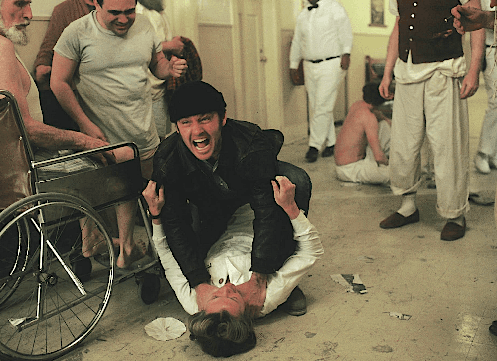Randle P. McMurphy (Jack Nicholson) seals his doom by choking Nurse Ratched (Louise Fletcher), in “One Flew Over the Cuckoo’s Nest.” (United Artists)
