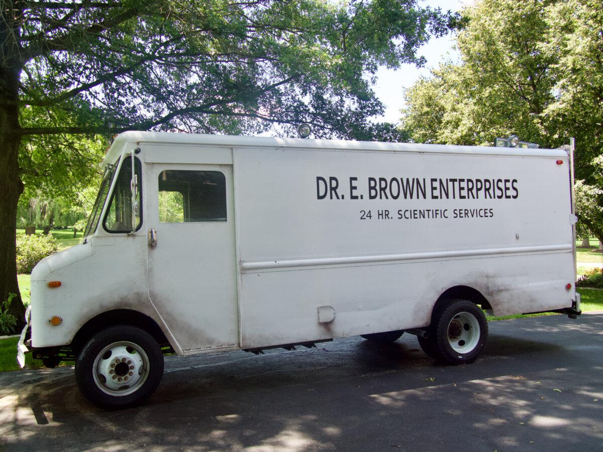 The Franchis haul their DeLorean "time machine" in a truck that matches Dr. Emmett Brown's from the "Back to the Future" movie franchise, near Chicago on July 1, 2025. (Travis Gillmore/The Epoch Times)