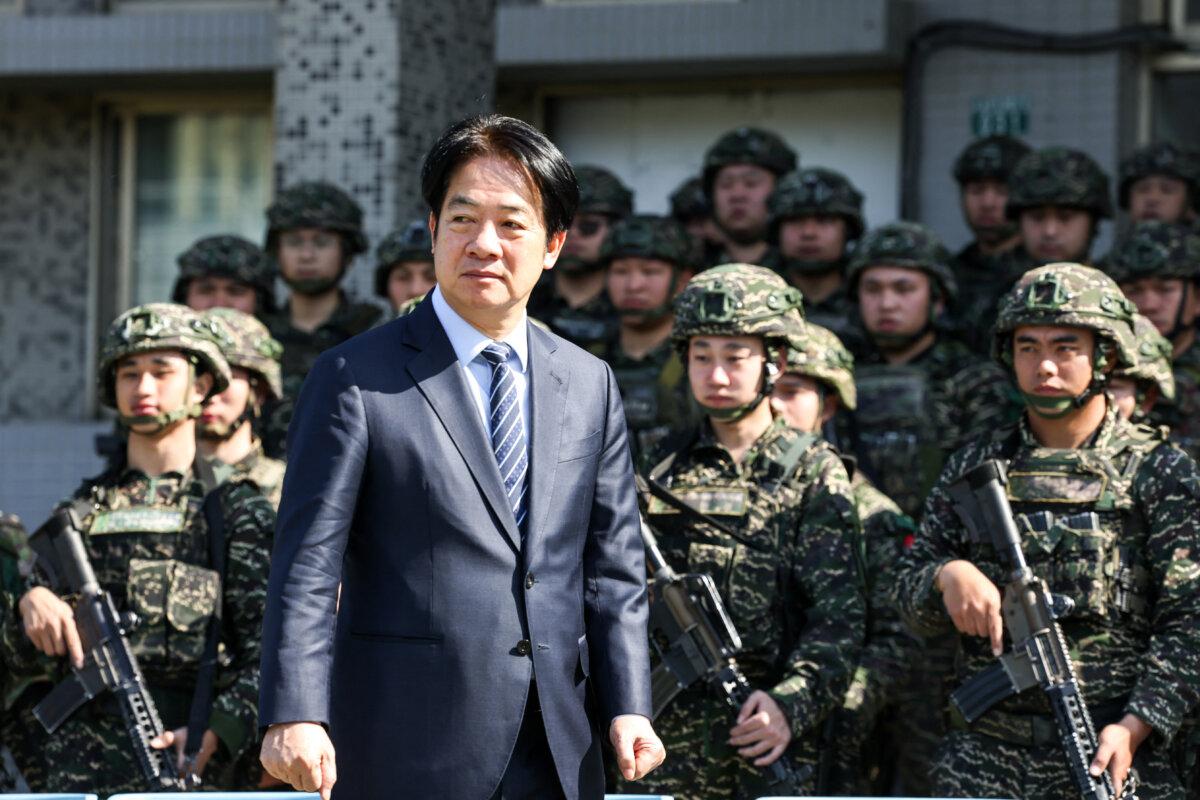 Taiwan's President Lai Ching-te inspects the troops taking part in the Rapid Response Exercise during a visit at the Songshan military airbase in Taipei on March 21, 2025. (I-Hwa Cheng/AFP via Getty Images)