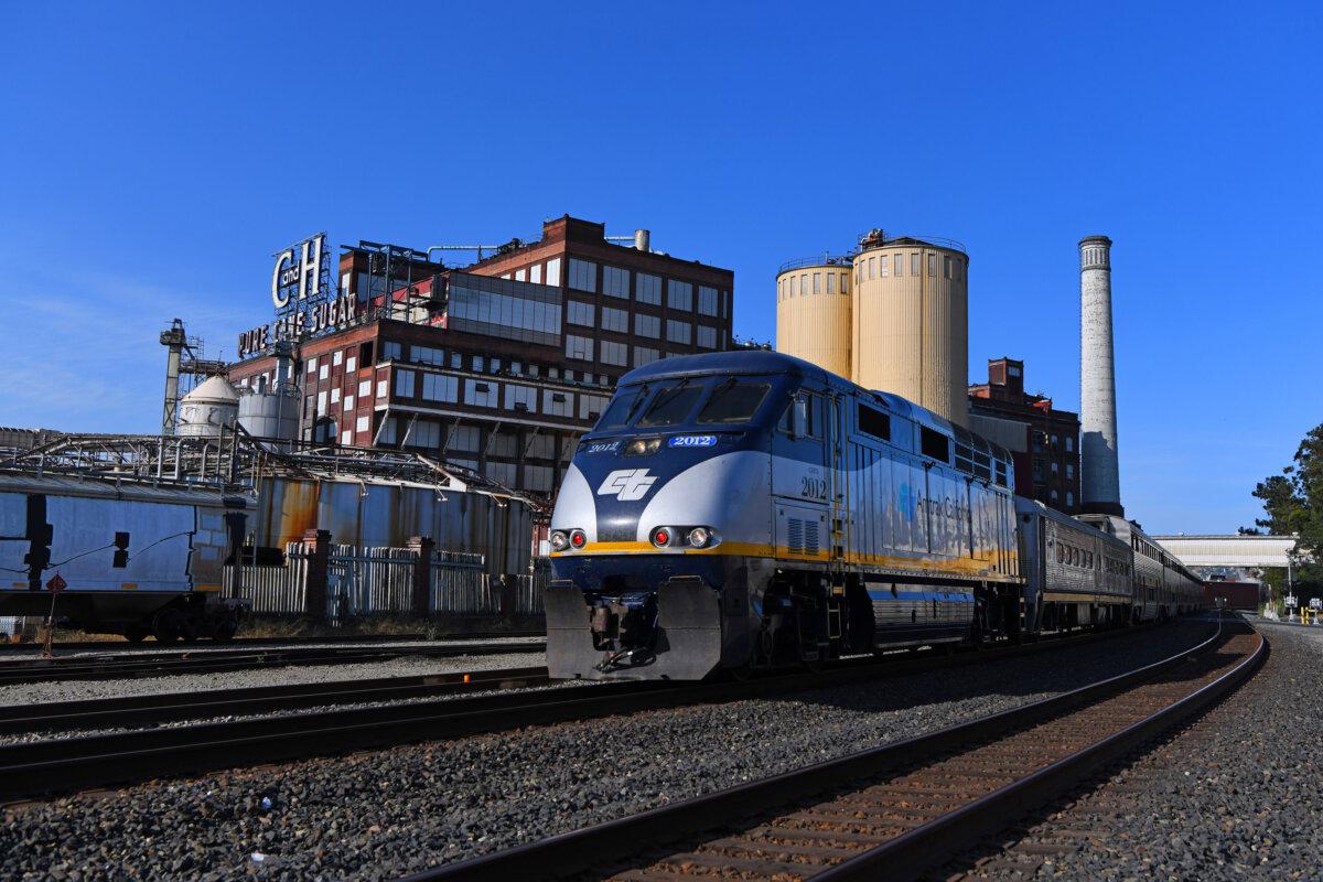 An Amtrak train speeds past the C & H Sugar Factory in Crockett, California, on Sunday, June 15, 2025. (Jose Carlos Fajardo/Bay Area News Group/TNS)