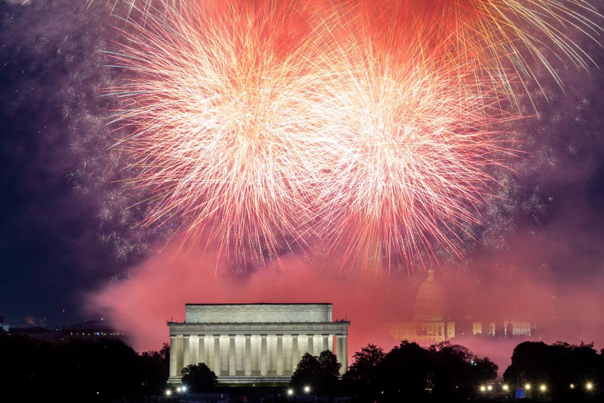 Fireworks illuminate the skyline above the Lincoln Memorial, Washington Monument, and U.S. Capitol during Independence Day celebrations, as seen from Arlington, Va., on July 4, 2025. (Mehmet Eser/Middle East Images/AFP via Getty Images)