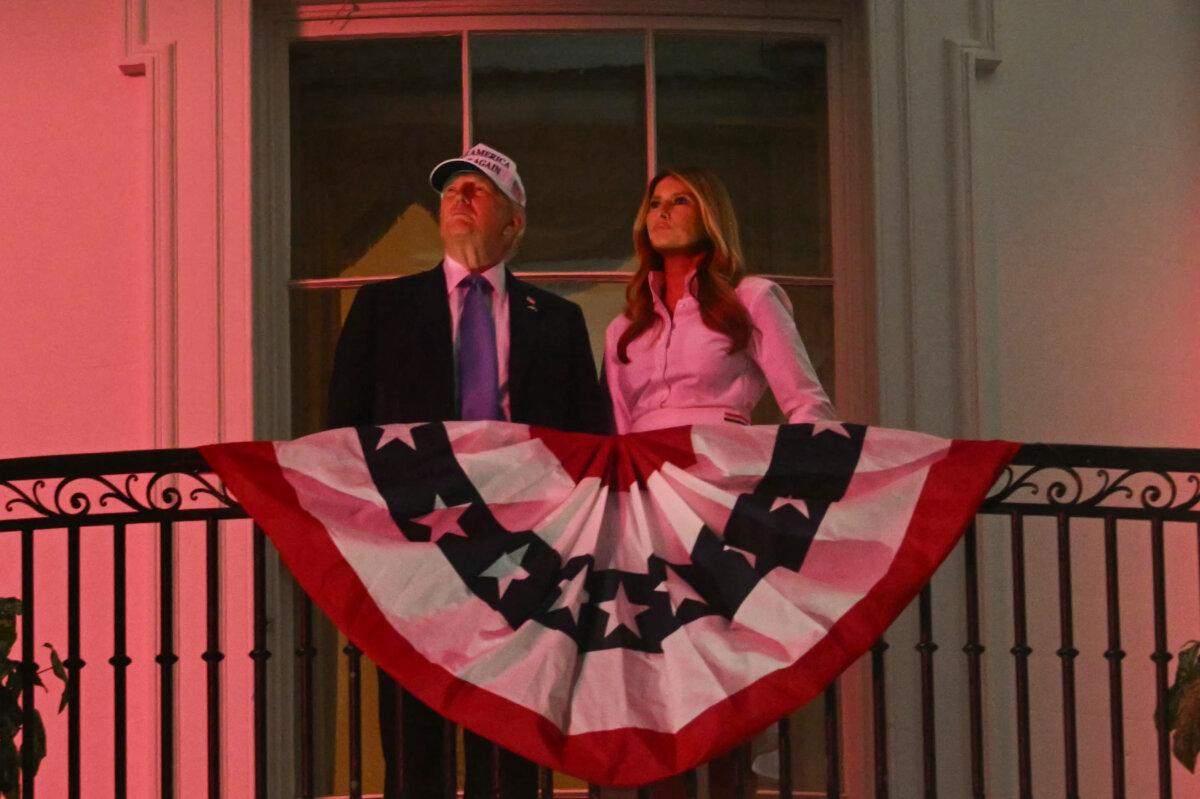 President Donald Trump and First Lady Melania Trump watch the Fourth of July Celebration Fireworks from the White House on July 4, 2025. (Jim Watson/AFP via Getty Images)