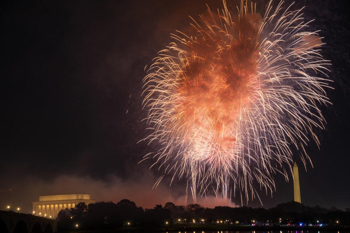 Fireworks illuminate the skyline above the Lincoln Memorial, Washington Monument, and U.S. Capitol during Independence Day celebrations, as seen from Arlington, Va., on July 4, 2025. (Mohammad Reza Mousavi/Middle East Images/AFP via Getty Images)