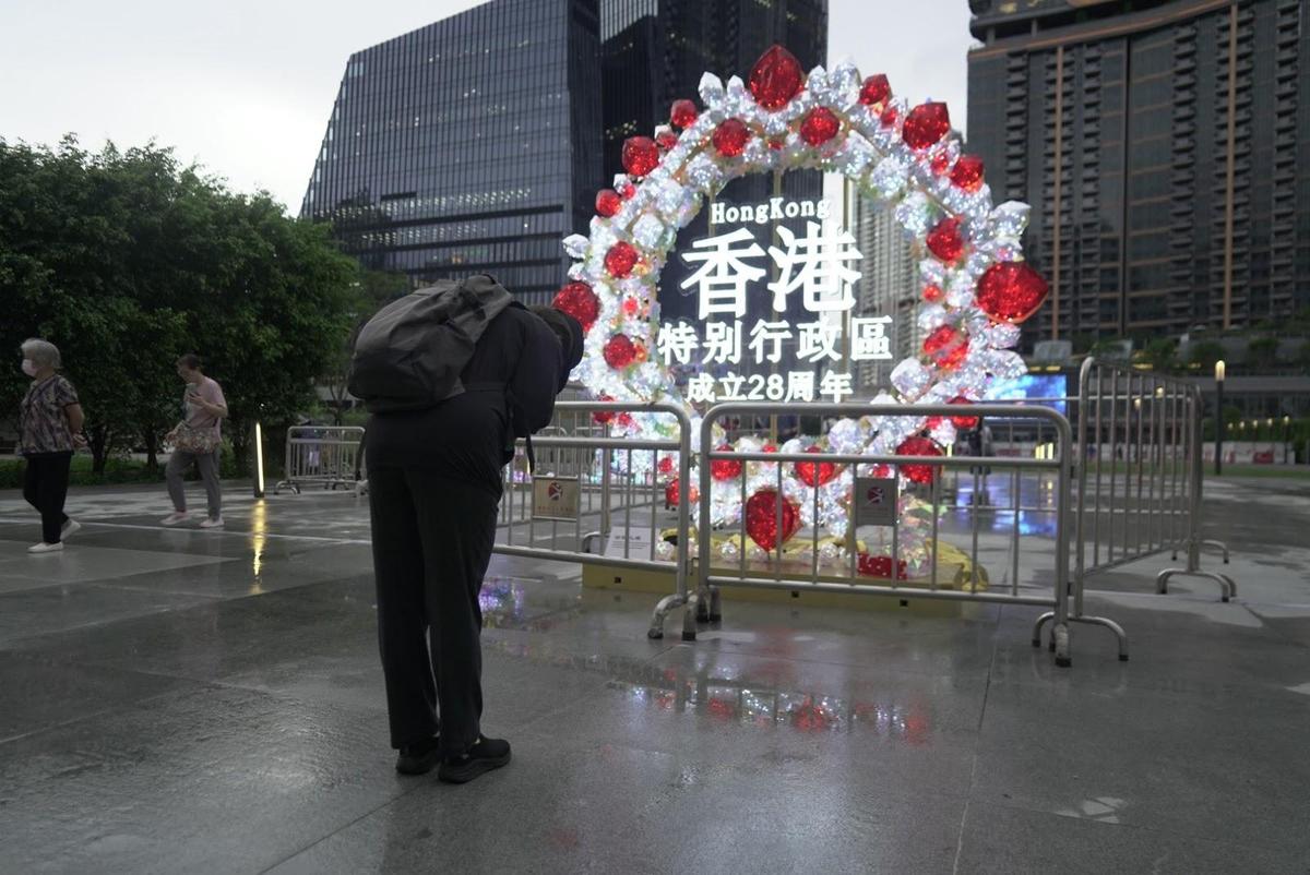 Hong Kong Locals Bow to Commemorative Plaque to Mourn 28-Year Anniversary of Transfer of Sovereignty