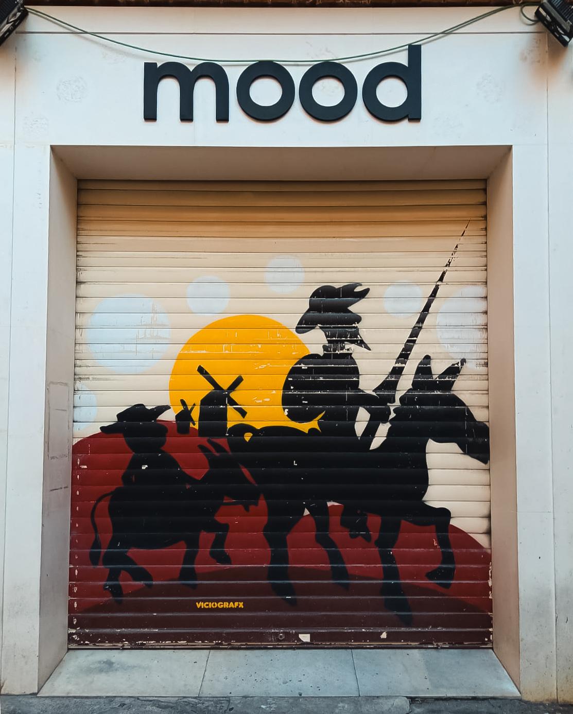 Street art depicting Quixote and Panza was painted on this store's security door. (Autumn Spredermann)