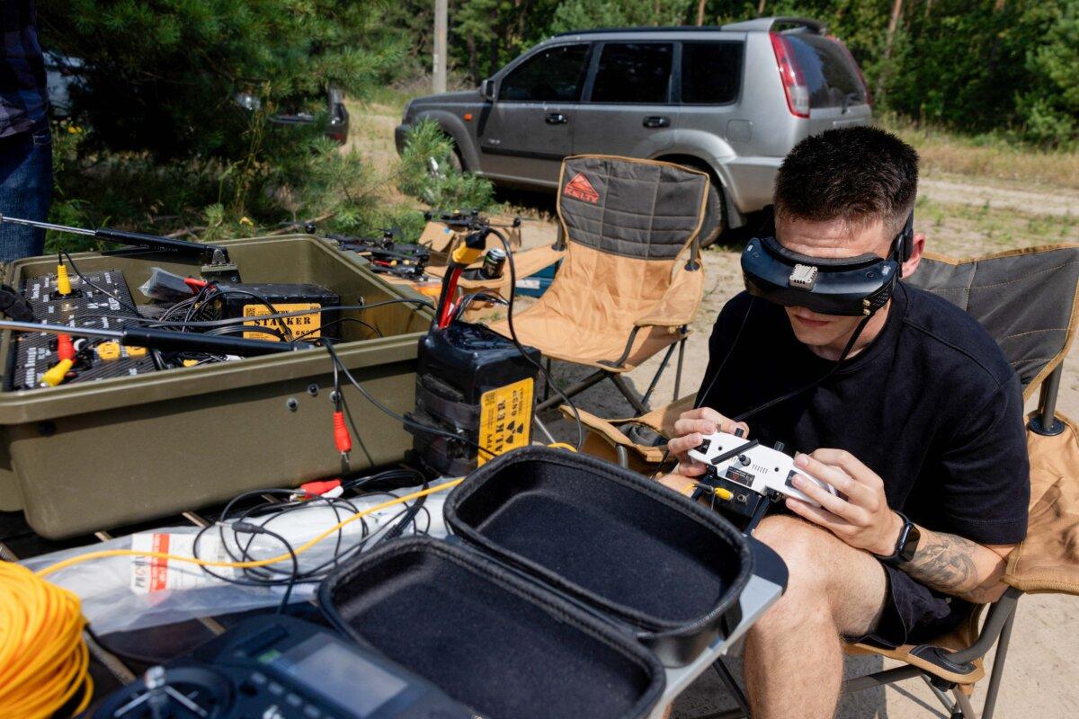 A drone pilot controls a Ukrainian fiber-optic first-person-view (FPV) Drone Stalker during tests at an undisclosed location on July 10, 2025. (Tetiana Dzafarova/AFP/Getty Images)