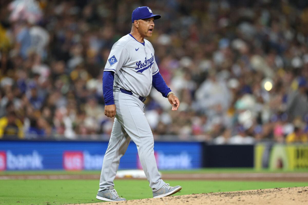 Los Angeles Dodgers Manager Dave Roberts walks to the mound to pull Matt Sauer (64) during the sixth inning of a game against the San Diego Padres at Petco Park in San Diego, Calif., on June 10, 2025. (Sean M. Haffey/Getty Images)