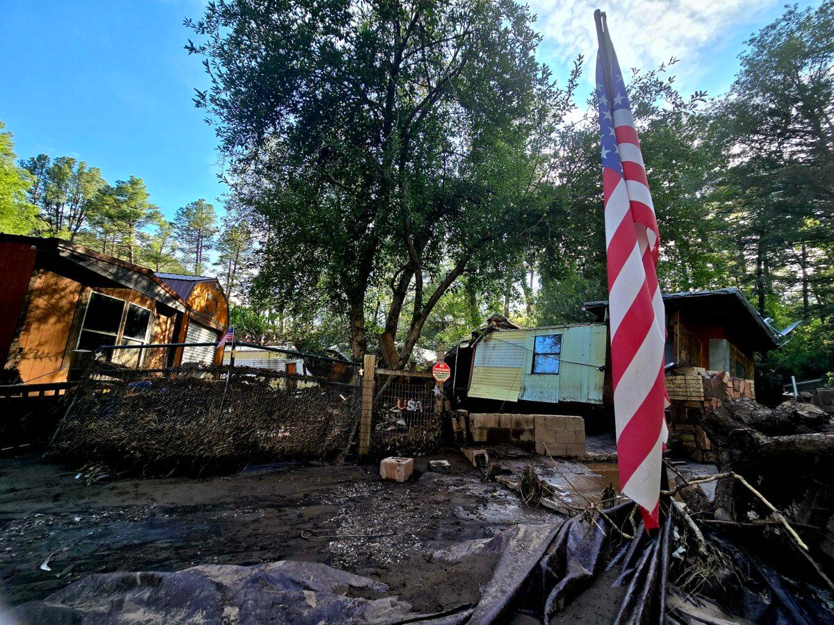 Other flood-damaged homes sit vacant near the banks of the Rio Ruidoso in Ruidoso, N.M., on July 9, 2025. (Allan Stein/The Epoch Times)